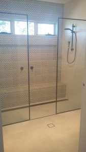 Frameless 10mm Toughened Shower Panel Framed in Black Frameless